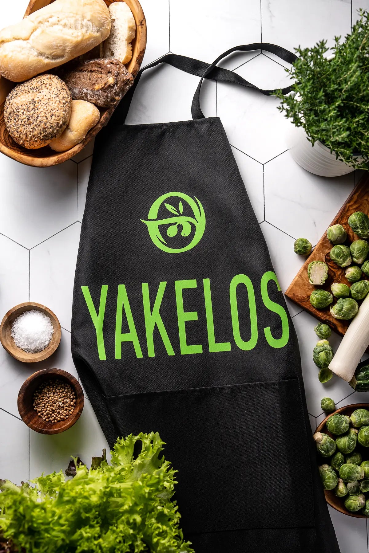 Yakelos Cook Apron, create, and enjoy in style with the Yakelos olive oil.